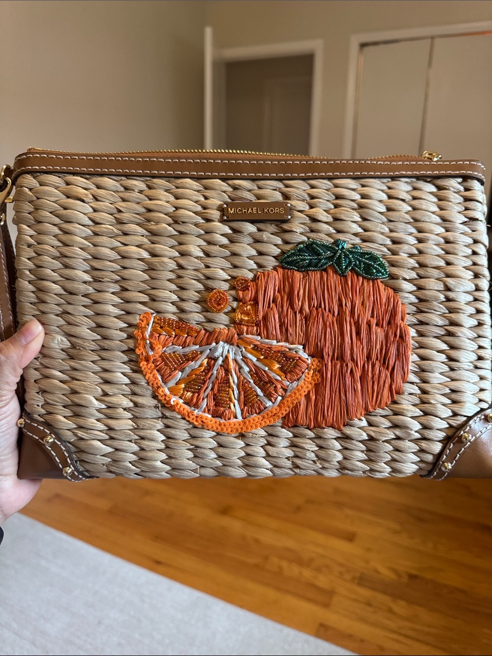 Michael Kors Woven Straw Wristlet with Orange Embroidery